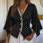 Blouse noire à pois blancs et manches à volants SecretBombe