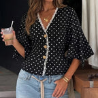 Blouse noire à pois blancs et boutons dorés SecretBombe